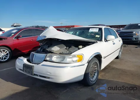 1999 Lincoln Town Car Cartier из США, поврежденный, VIN 1LNHM83W0XY716443